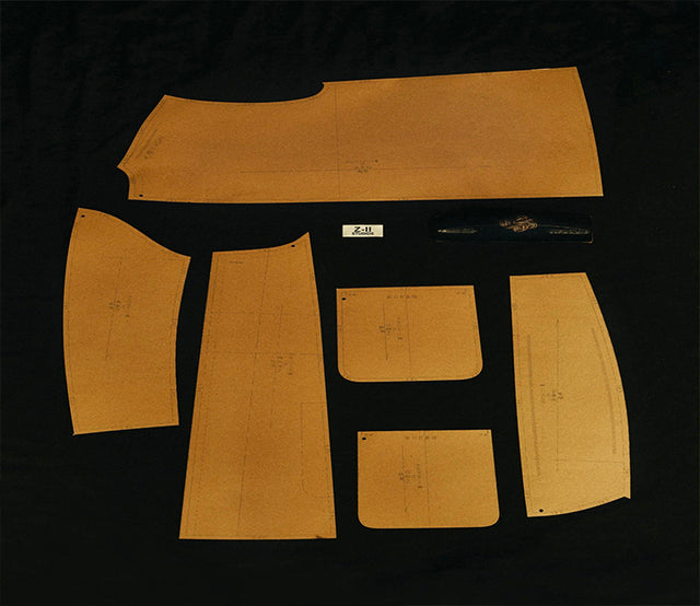 A standard clothing design sketch, printed with "ZII STUDIOS", is placed against a black background.